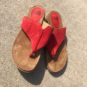 Red leather flip flops.